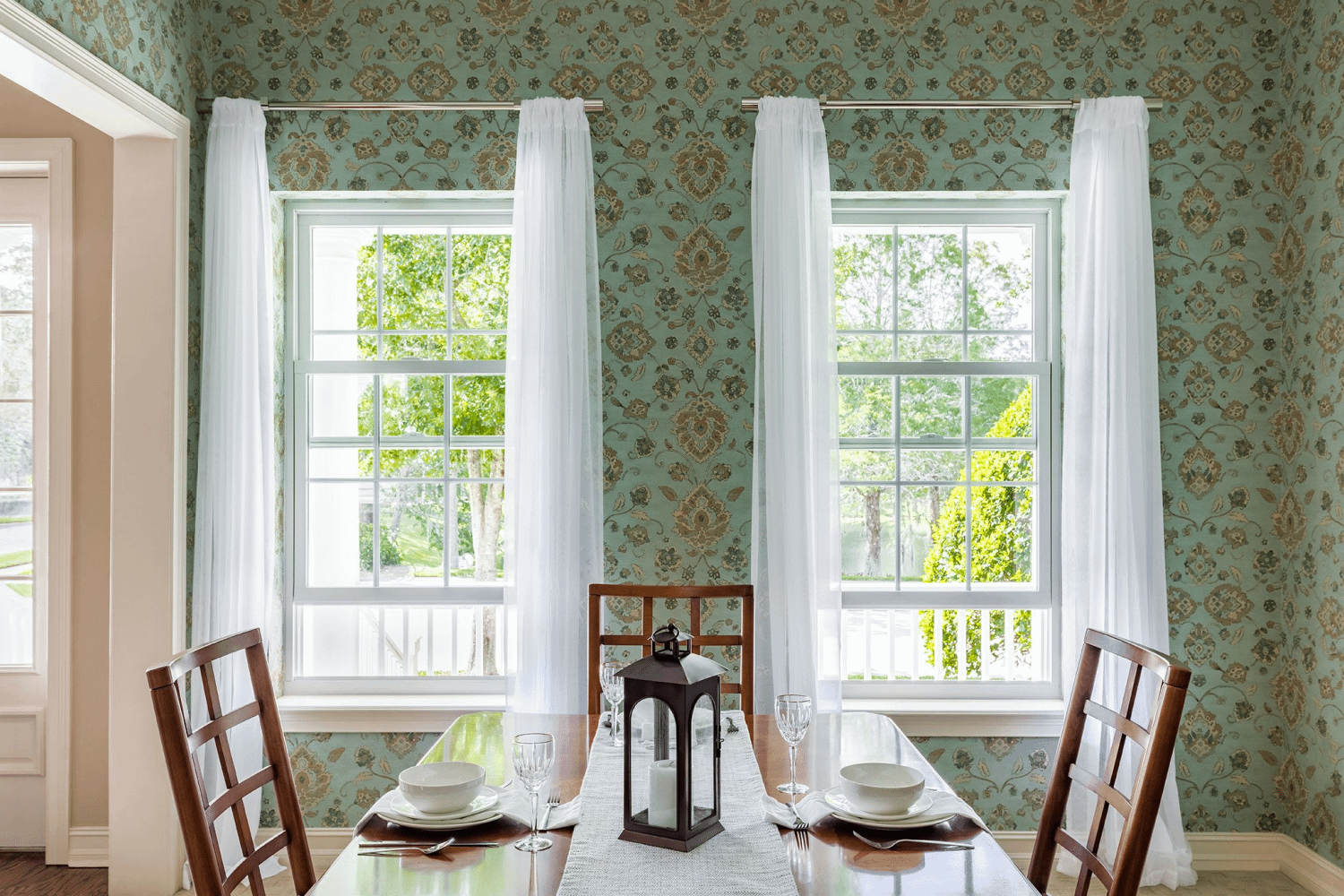 Dining room showcasing beautiful Renewal by Andersen windows