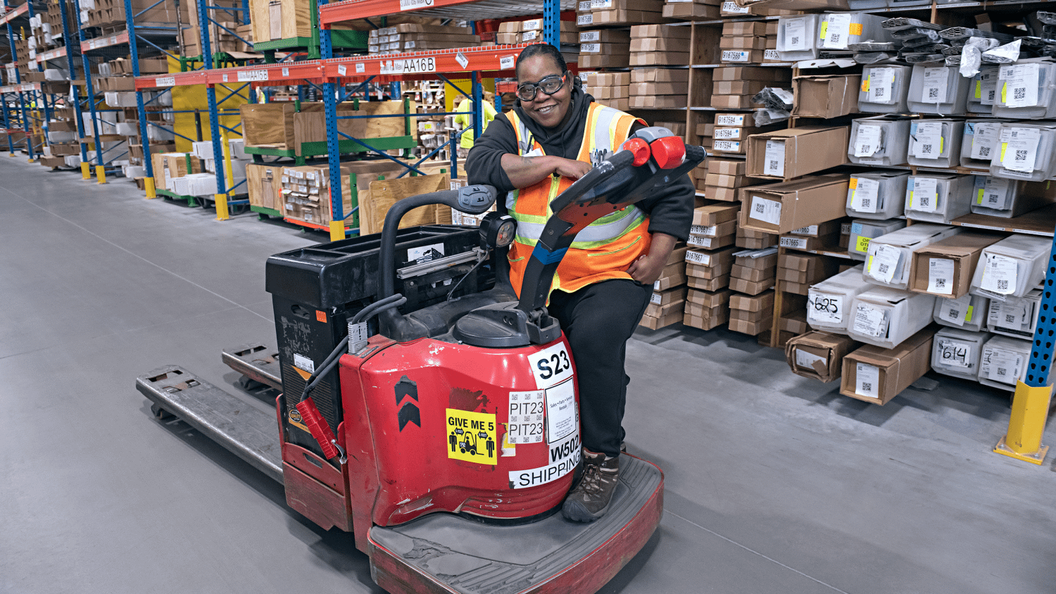 Renewal by Andersen employee sitting in a warehouse forklift