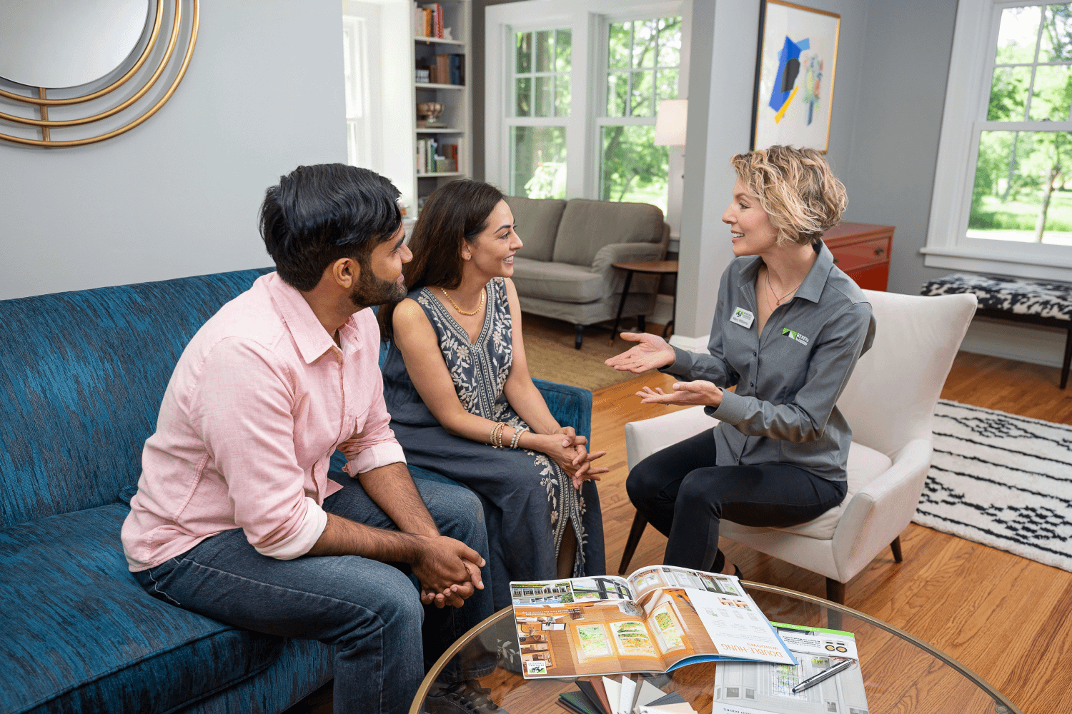 Sales person talking to a homeowner about their window replacement options