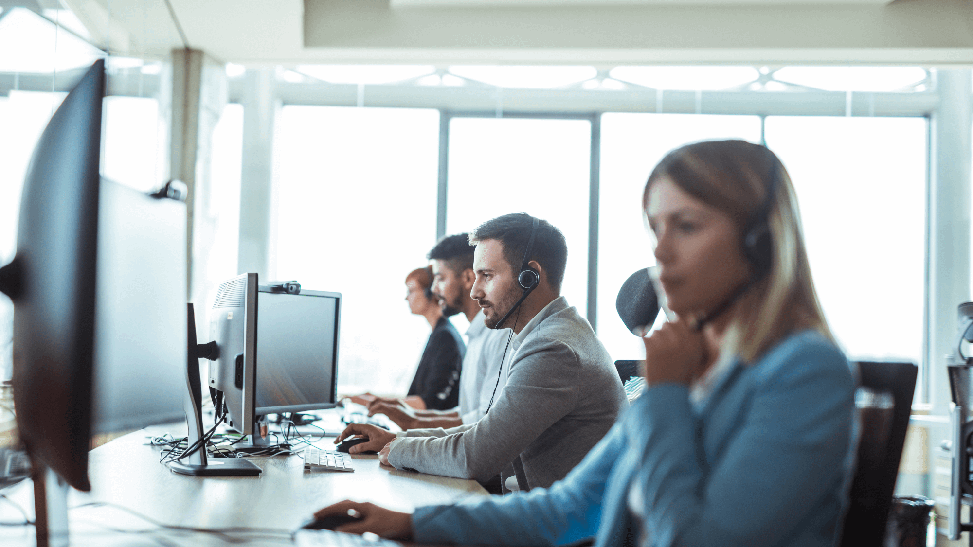 Renewal by Andersen Call Center agents talking with homeowners to schedule in home consultations for windows/doors replacement