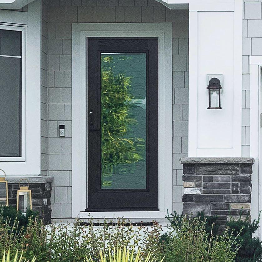 A single panel Ensemble entry door. The door is black and has full-light glass. It has white trim.