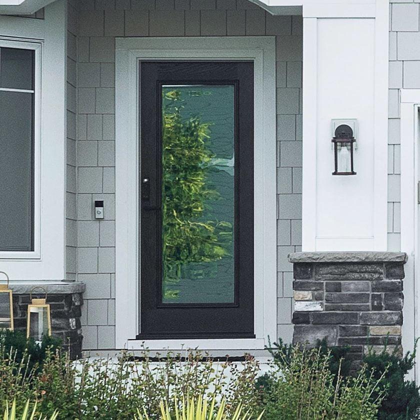 A single panel Ensemble entry door. The door is black and has full-light glass. It has white trim.