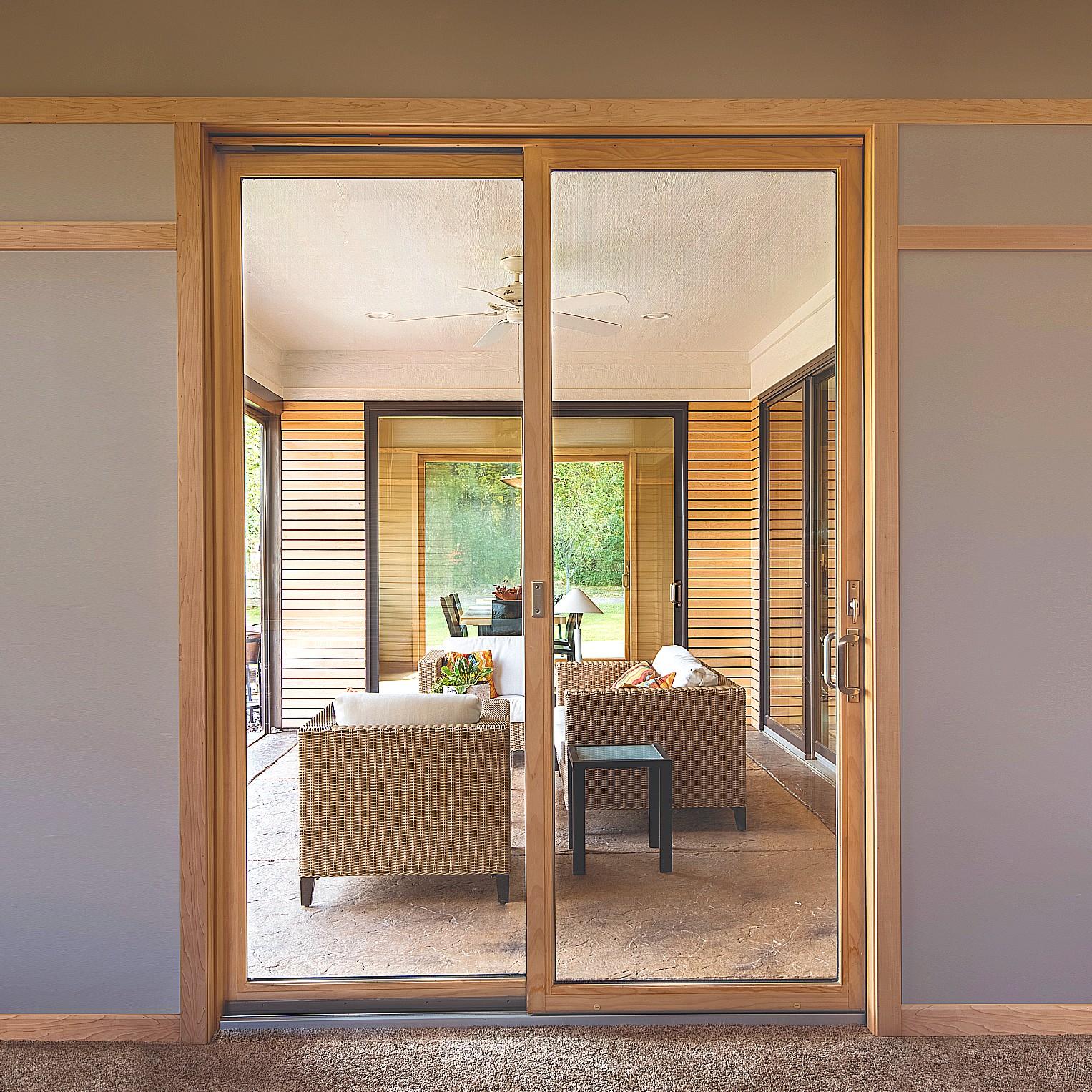 Narroline modern sliding patio doors with wood finish.