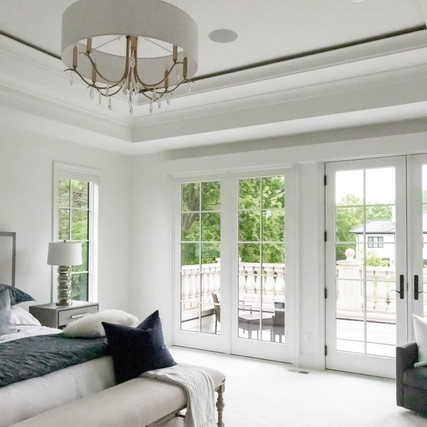 Hinged french patio doors along with fixed patio doors let in a lot of light.