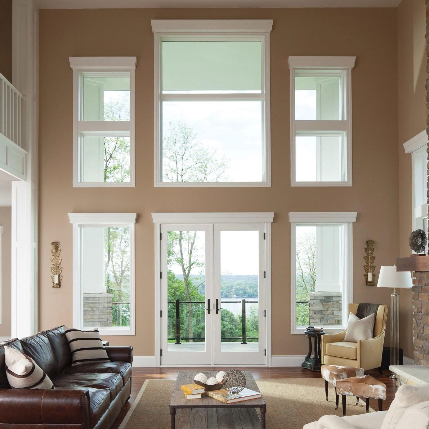 Hinged French doors that swing in and a giant window wall.