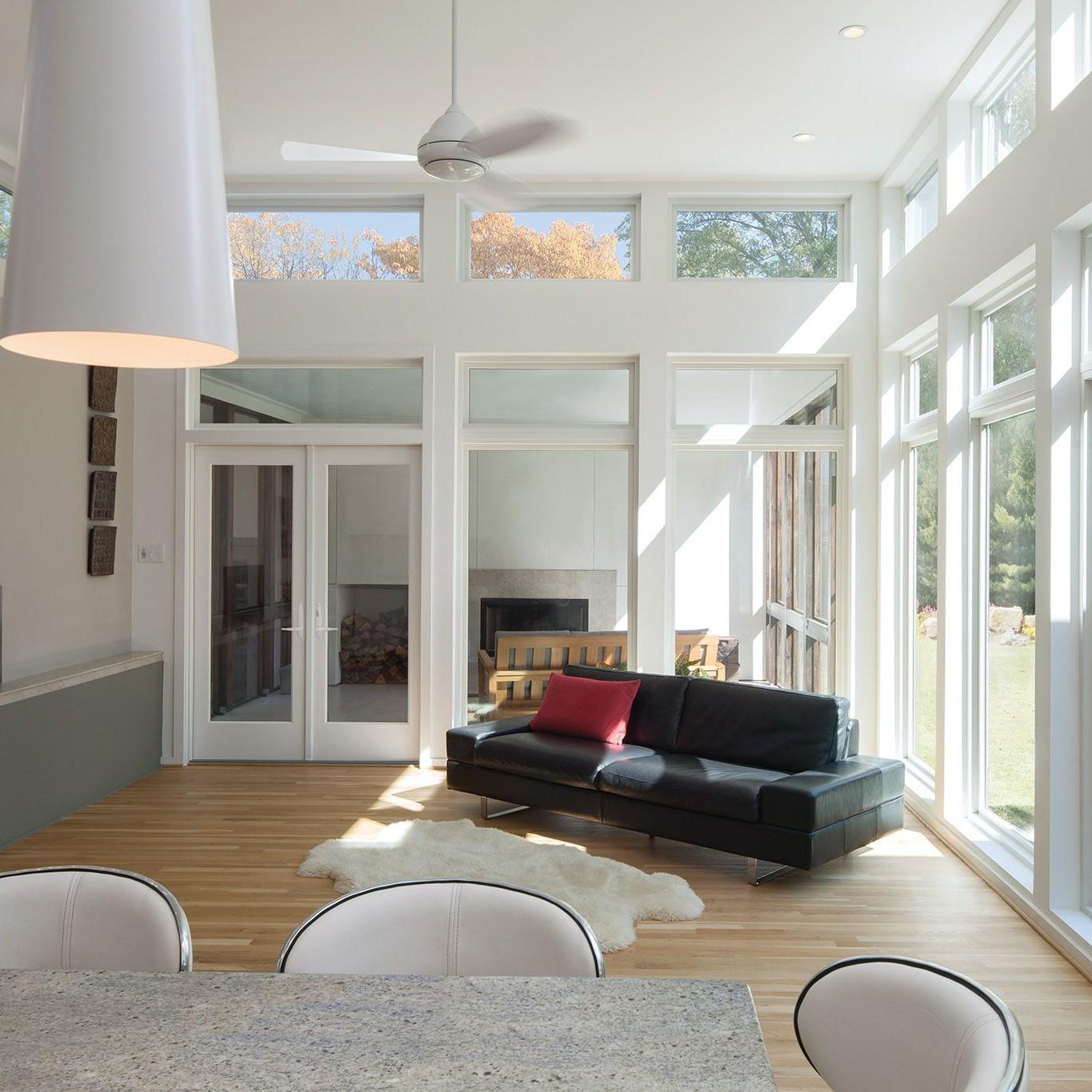 White inswing french doors in a sun room.