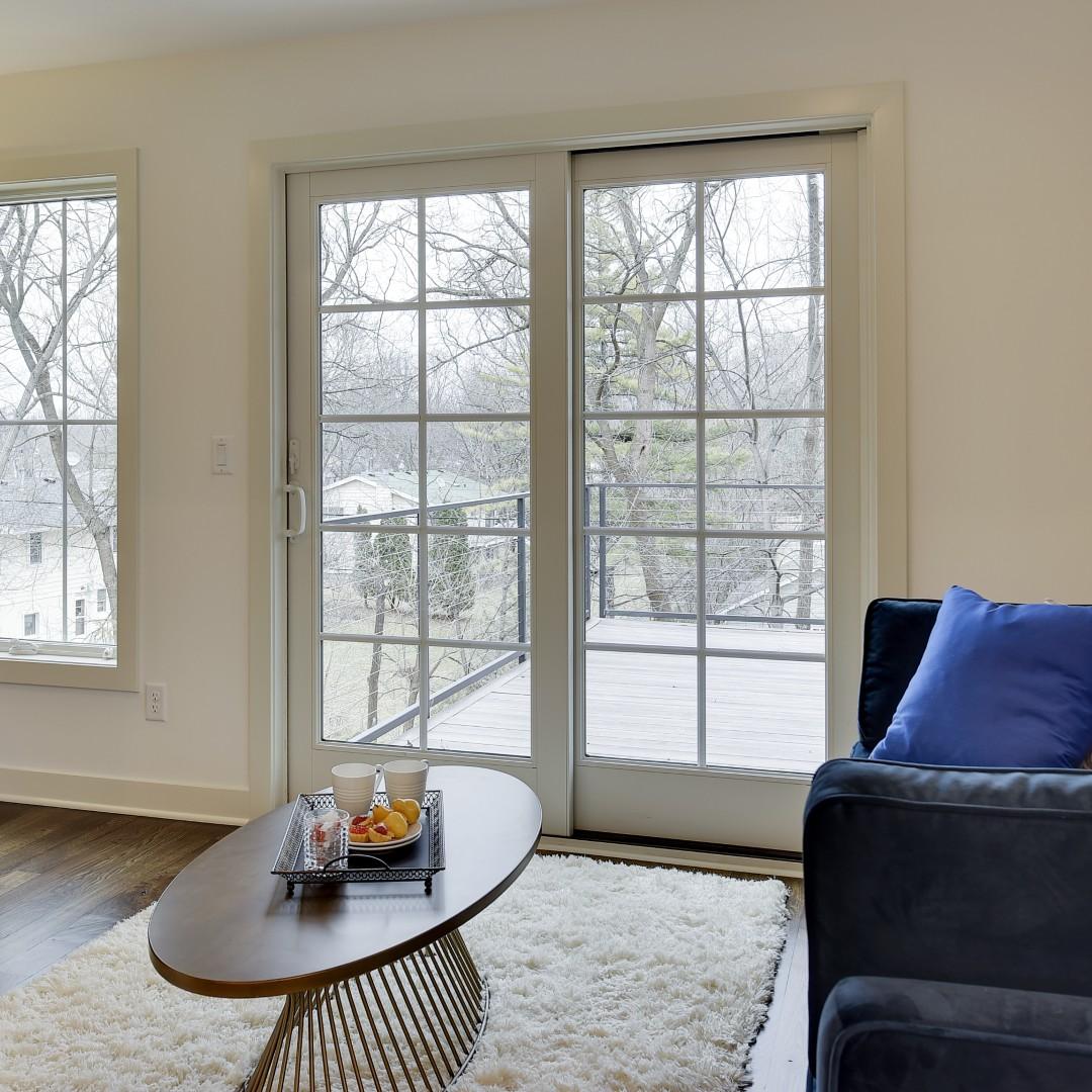 A sliding french door with equal lite grilles. The sliding door is a space saver.