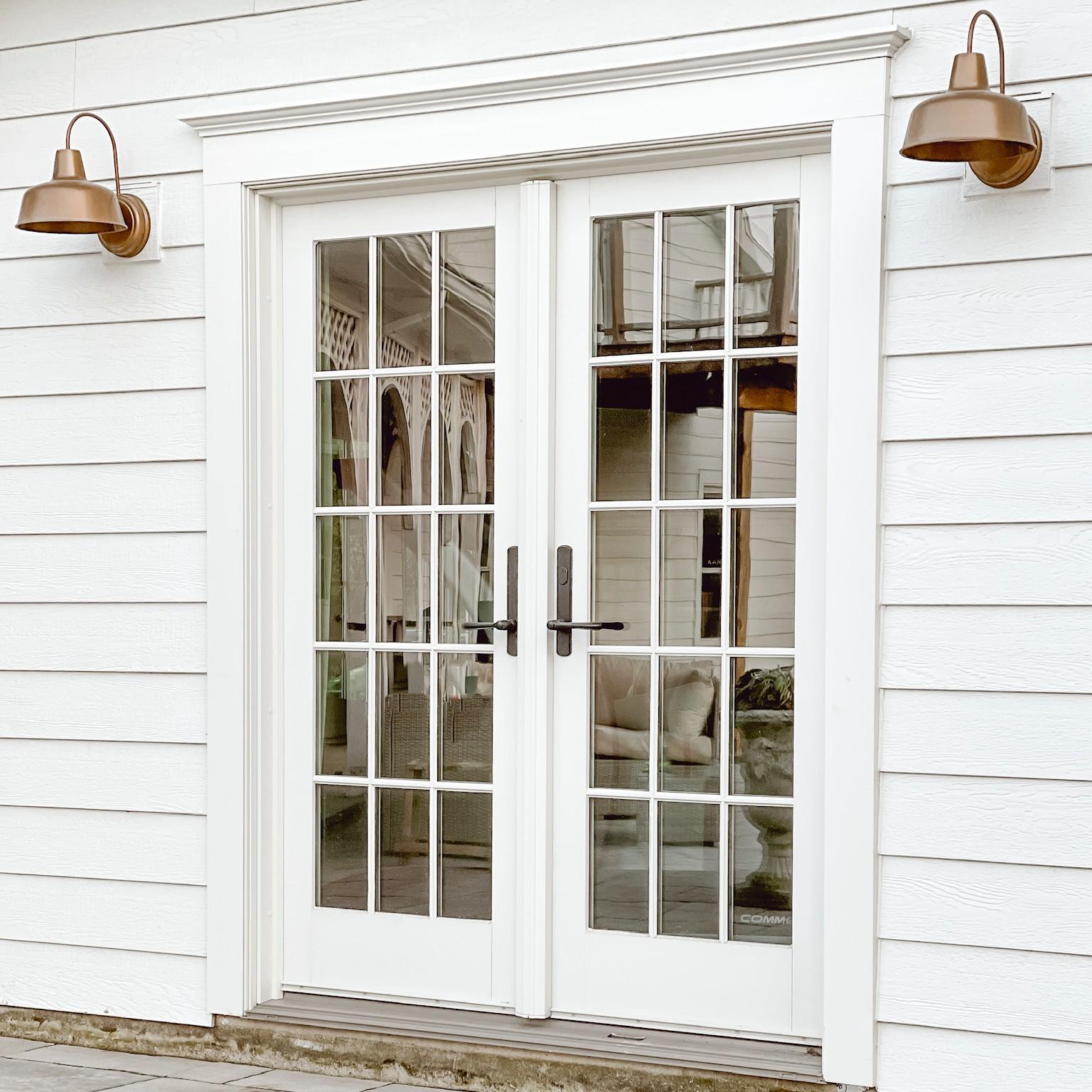 A set of A-Series hinged inswing doors with colonial grilles at Liz Marie Galvan's home.