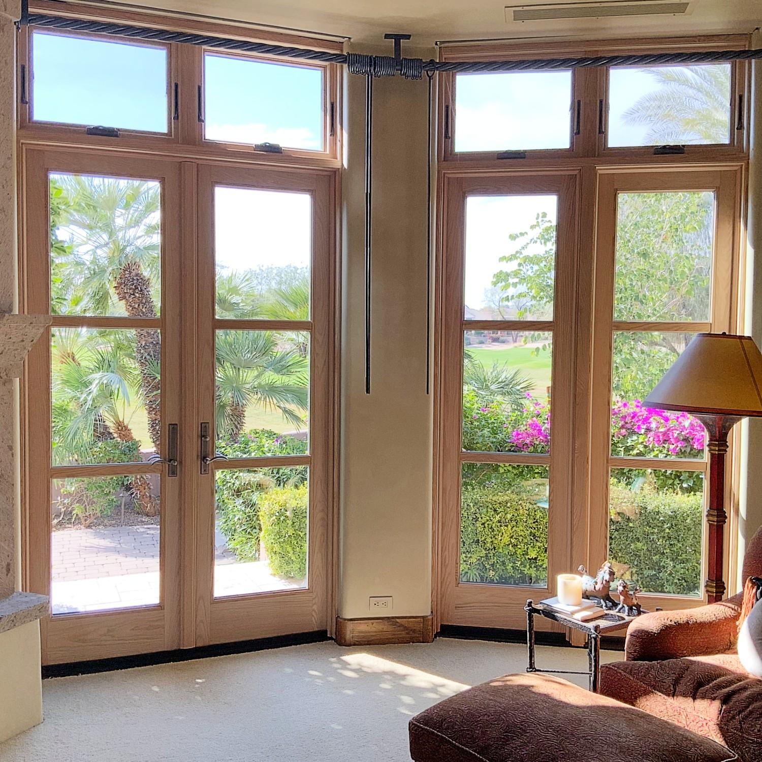 A series hinged inswing doors with unique equal lite grilles that match the surrounding windows.
