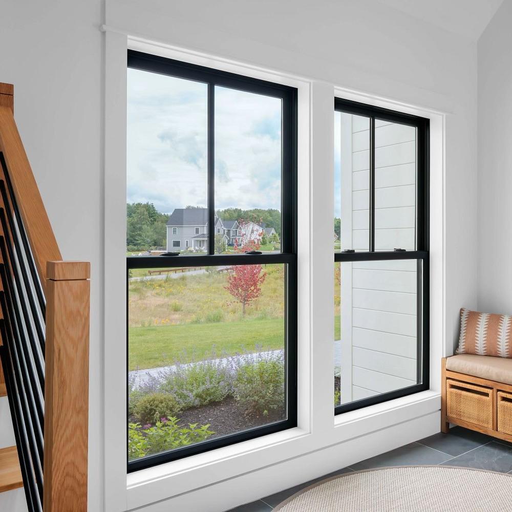 Extra large double hung windows with farmhouse grilles