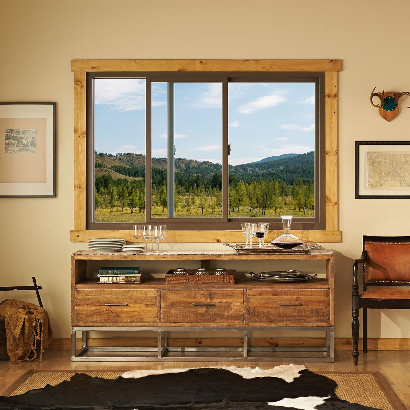 A buffet or side table in a dining room. The decor is rustic cowpoke. 
