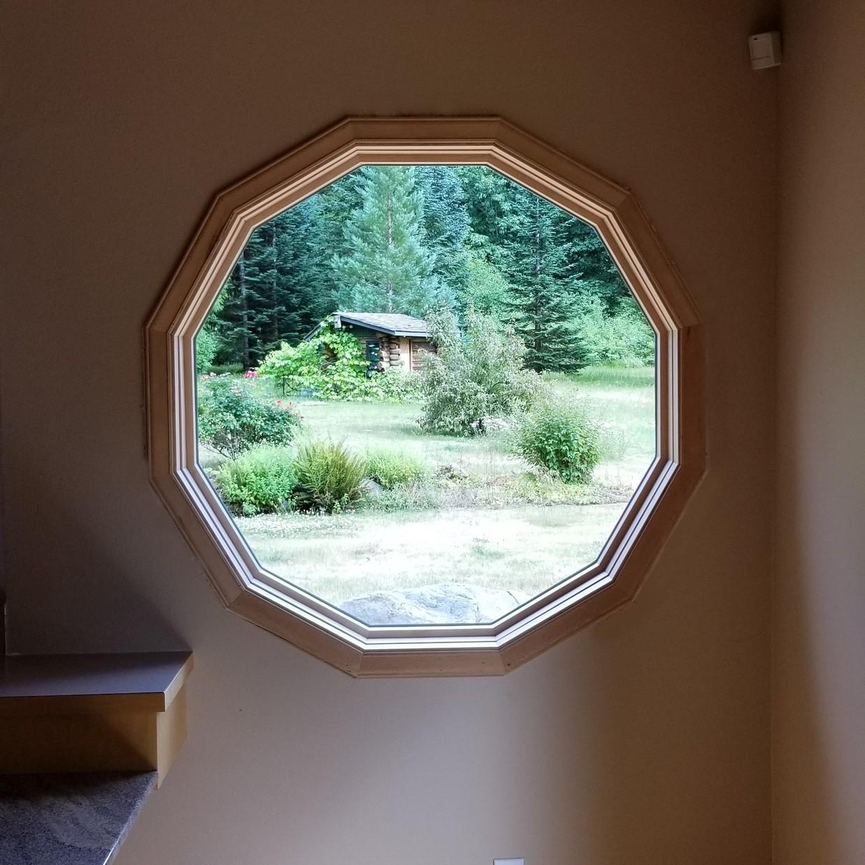 A specialty window in a circle shape that has 12 sides