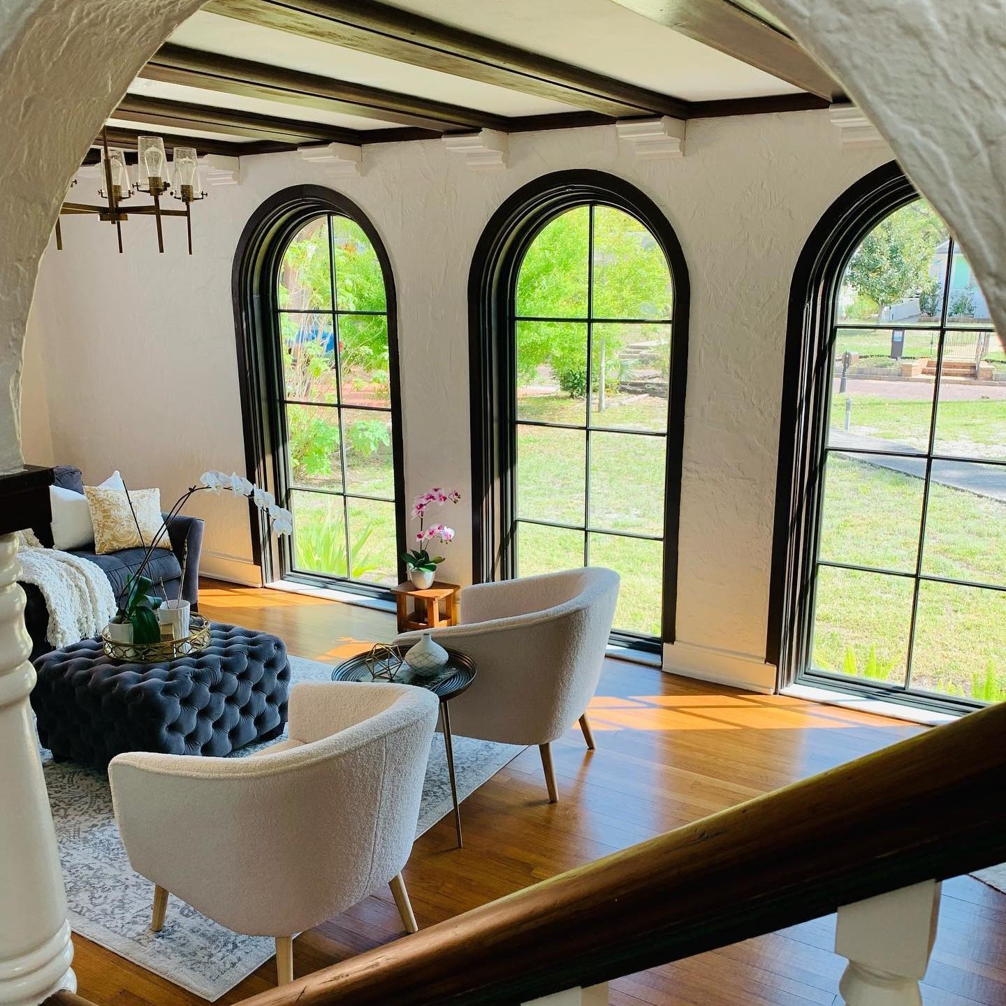 Springline windows in a southwest style home. They are black with black grilles.