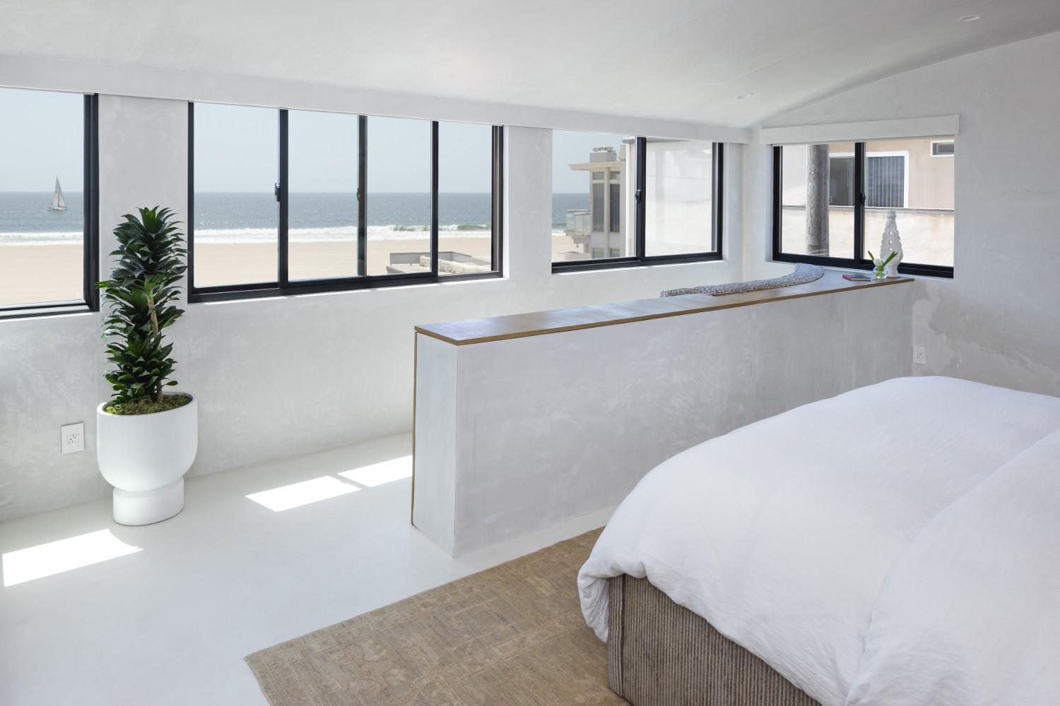 The primary suite in Breegan Jane's california beach house.