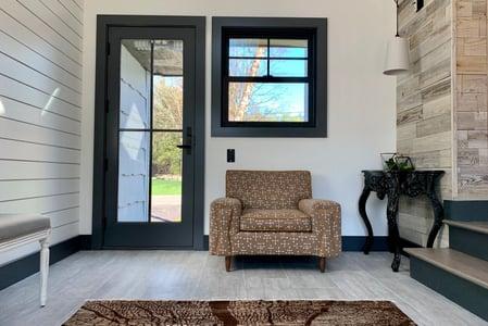 John's entry way with his a-series door and a square window.